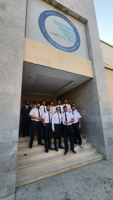 A class gathered at the academy entrance
