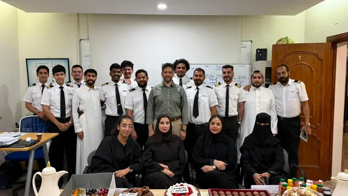 A mixed cohort celebrating the end of their course