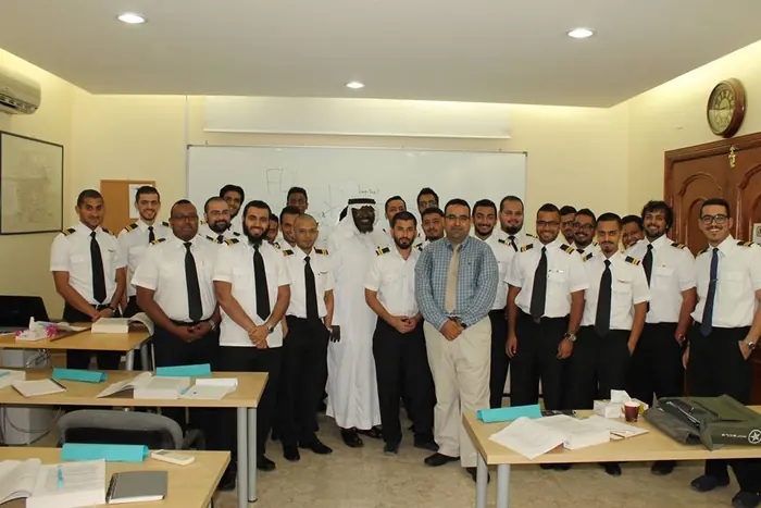 A graduating class with their instructors