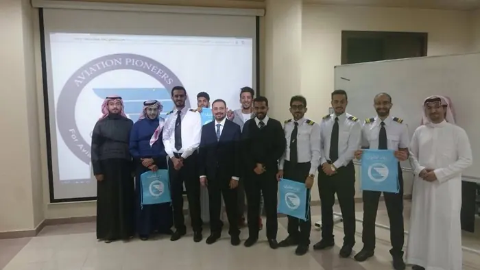 A class with guests after a course presentation