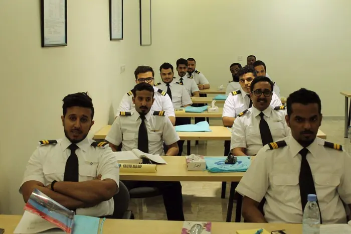 Trainees working through coursework in class