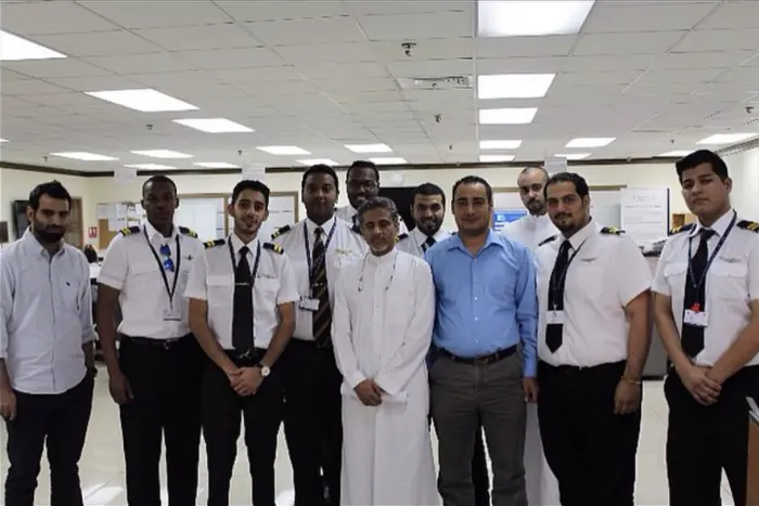 Trainees with the team at an operations office