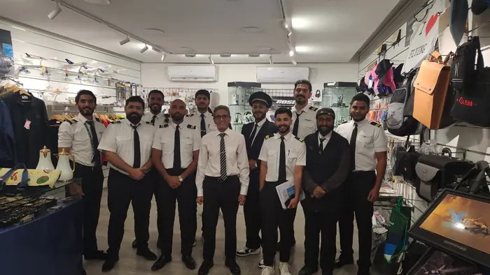 Trainees at the pilot shop counter