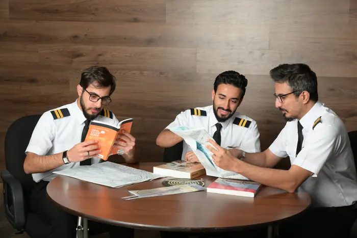 Three trainees working through course material together