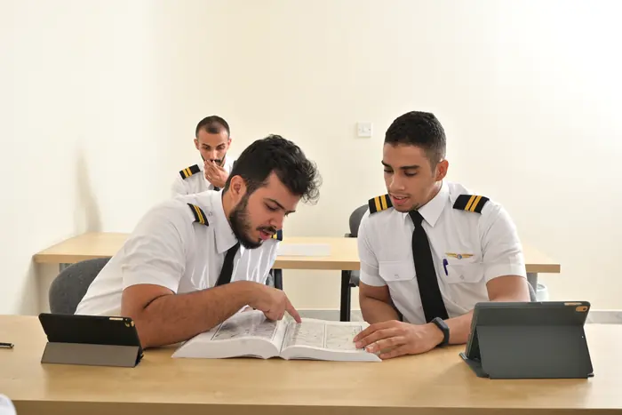 Trainees working through their course textbooks